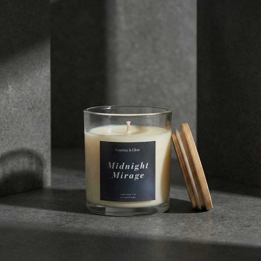 Candle labeled 'Midnight Mirage' with wooden matches on a dark surface