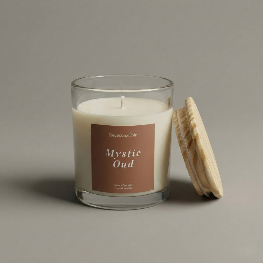 Glass candle with wooden lid labeled 'Mystic Oud' on a neutral background