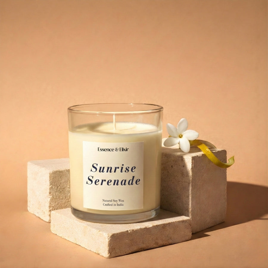 Candle labeled 'Sunrise Serenade' on a beige background